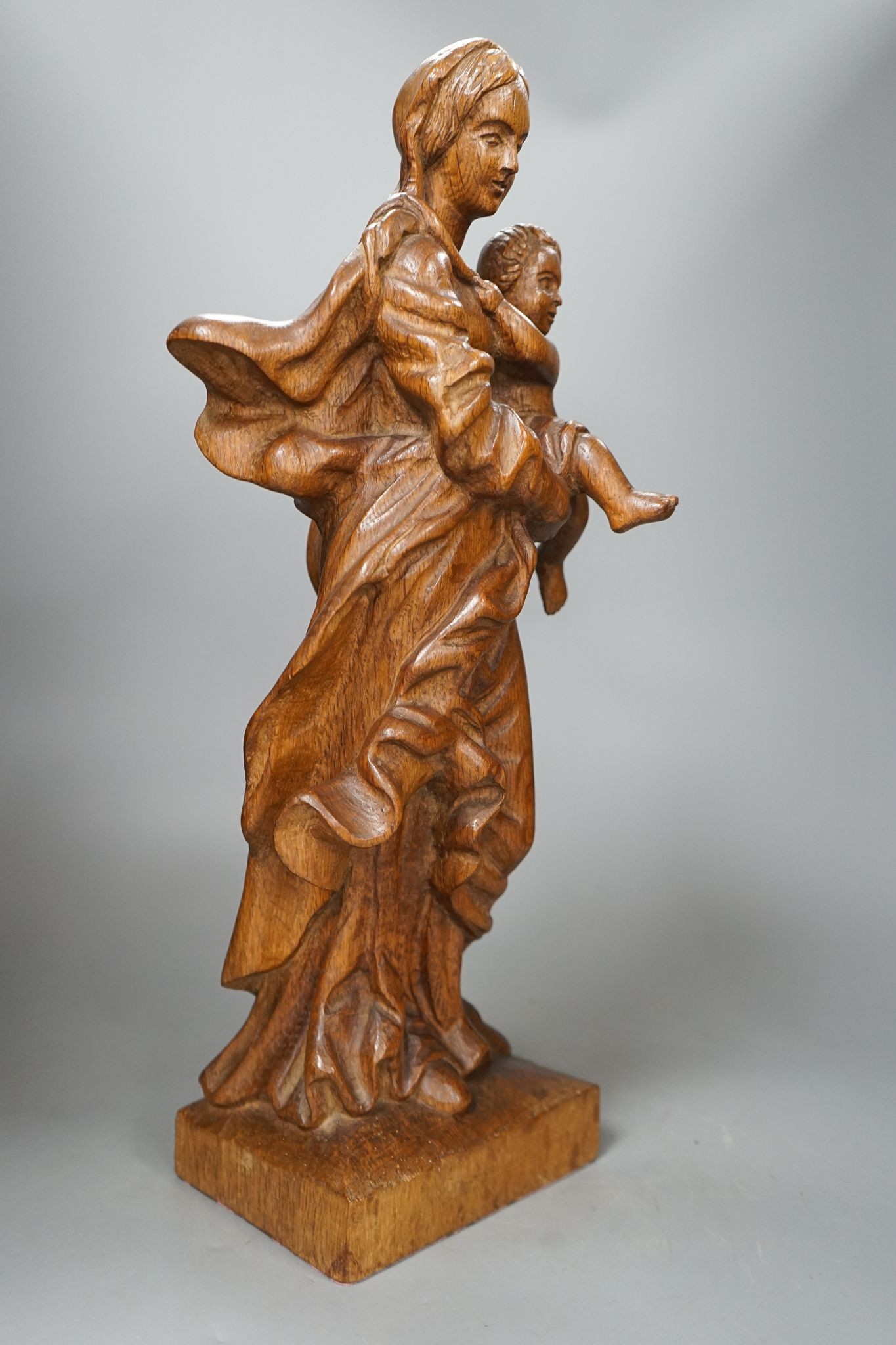 A 19th century carved oak Madonna and child, 49cm